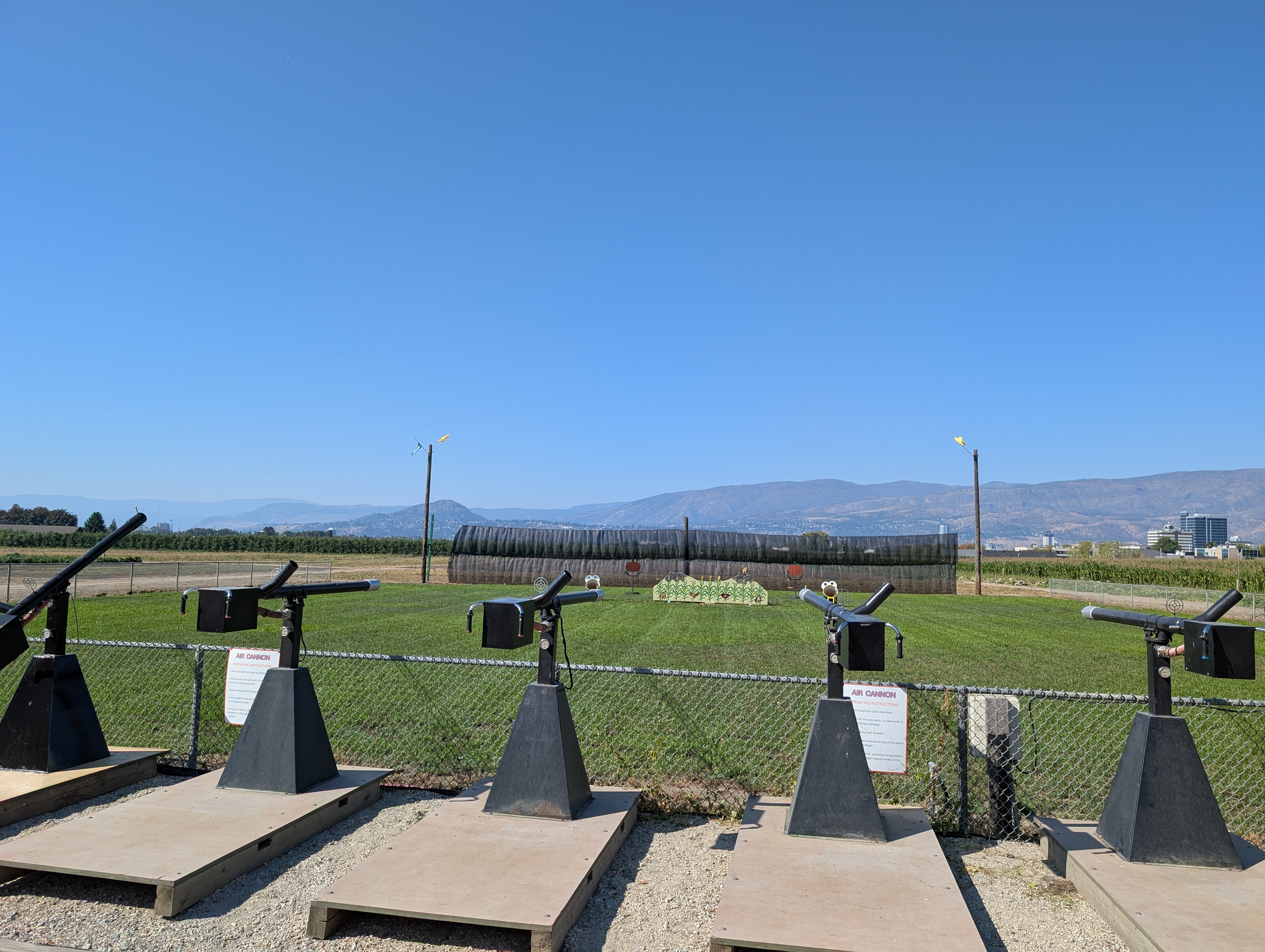 Rustic air cannons facing a target range