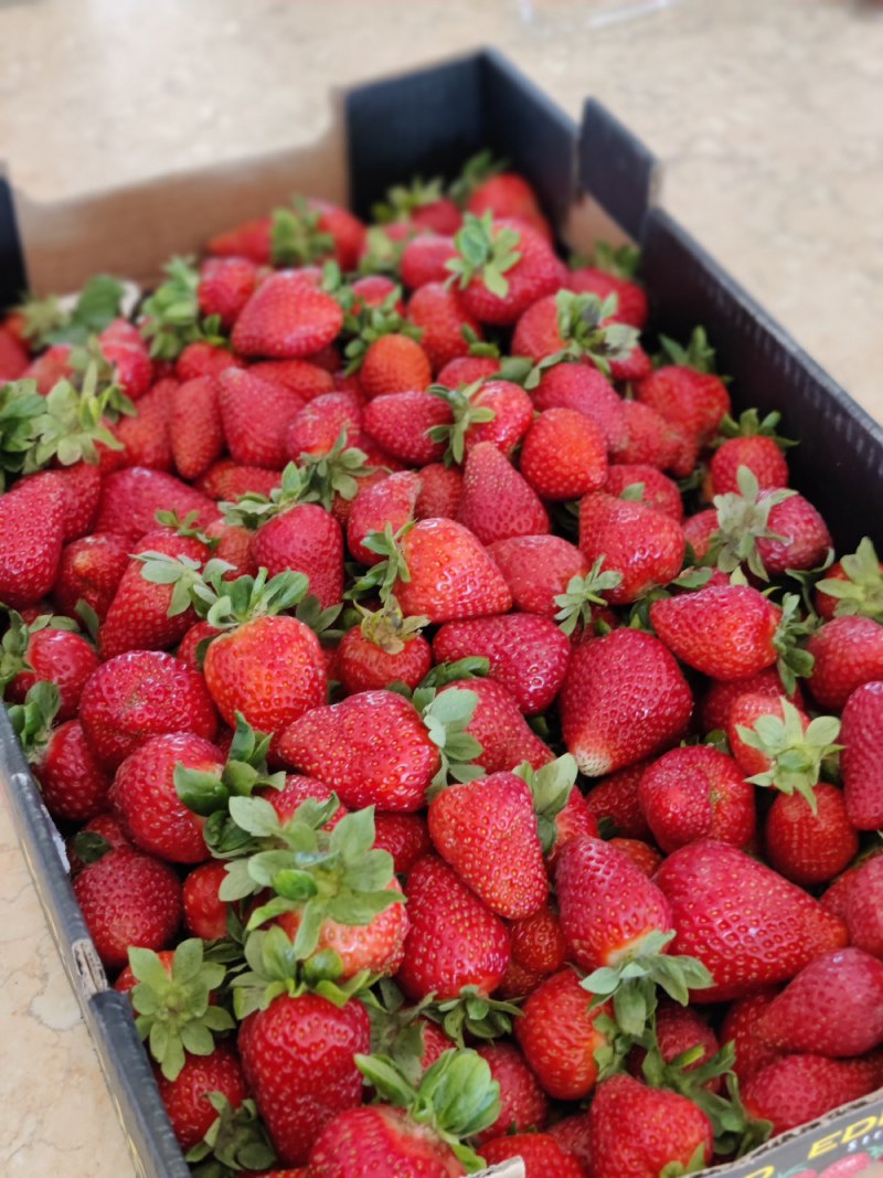 Close up of fresh strawberries at the farm stand